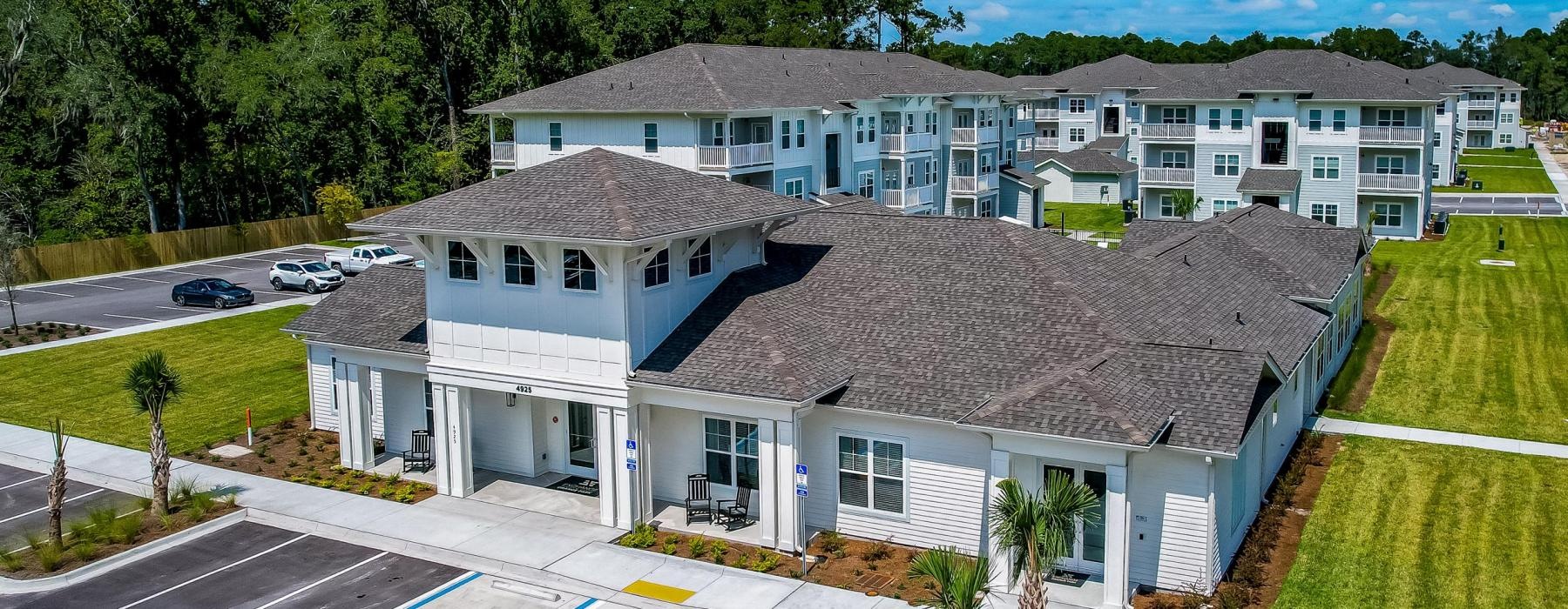 aerial shot of leasing office/clubhouse and parking lot